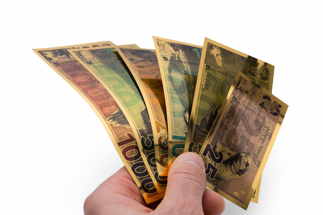 2025 natural treasure gold bullion bills held in hand