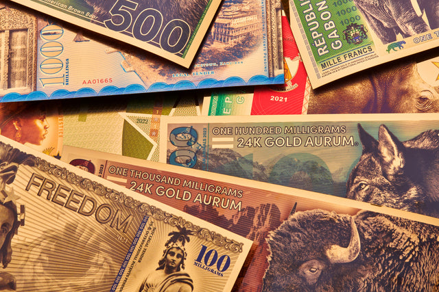 Various assortment of Valaurum gold bills including legal tender and investment grade bullion series