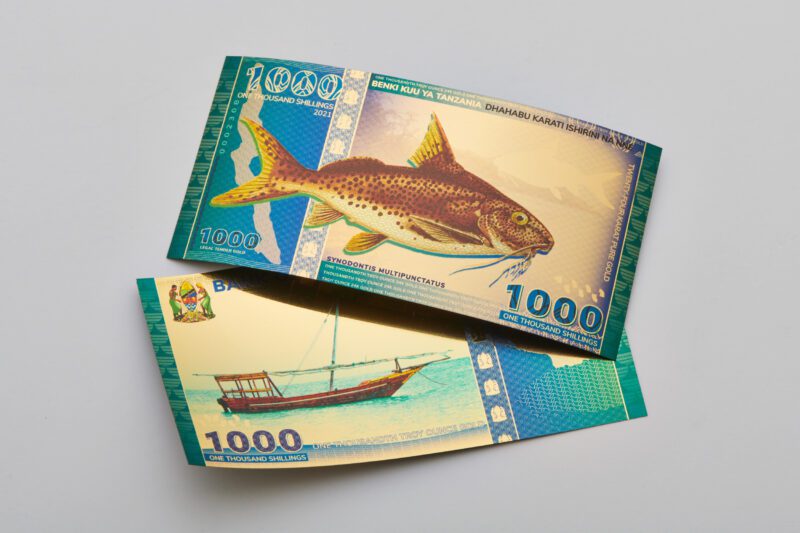 Obverse and reverse sides of the Tanzanian 1000 Shilling Lake Tanganyika Catfish Aurum® gold bill.