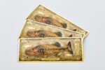 A fan of three North American Game Fish Largemouth Bass Aurum Bills.