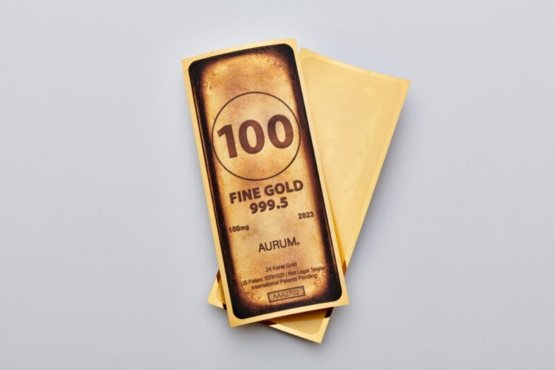 The front and back of a 2023 Gold Bar Aurum bill.
