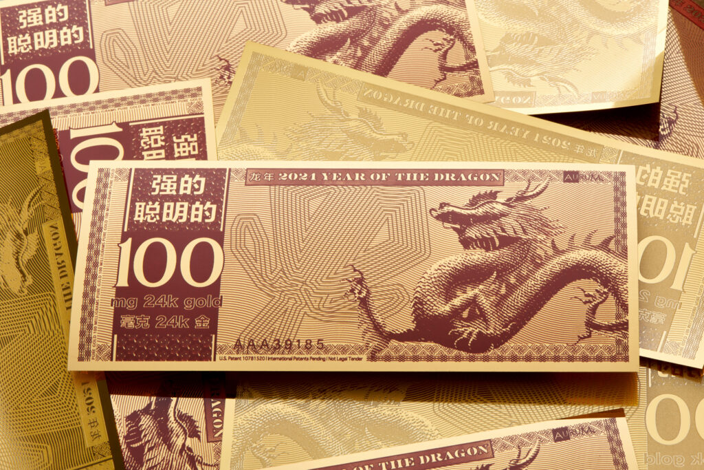 Mixed obverse and reserve Year of the Dragon bills in a pile.