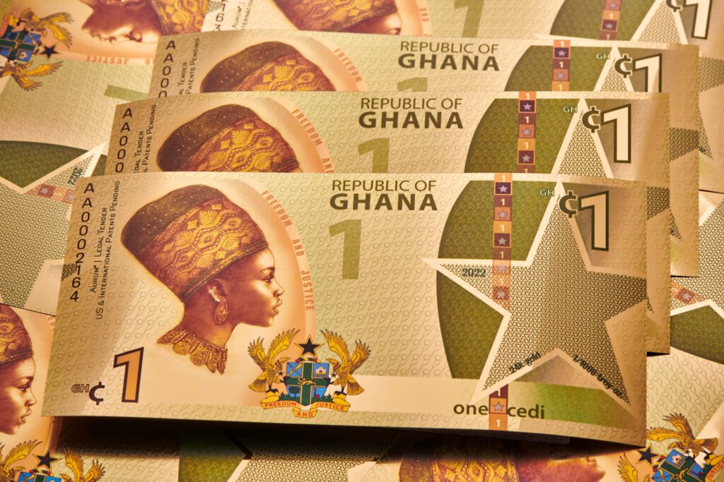 The obverse side of multiple Republic of Ghana - 1 Cedi Justice Gold Aurum® gold bills.