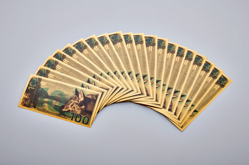 100mg North American Gray Wolf Aurum® Gold Bill, Any Year, Stack of 20 bills product fan.