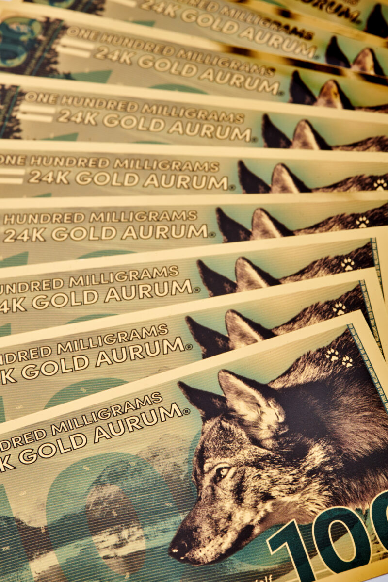 100mg North American Gray Wolf Aurum® Gold Bill, Any Year, Stack of 20 close-up product fan.
